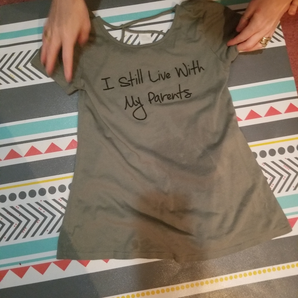 A green shirt with slogan